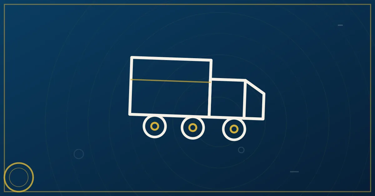 White box truck with enclosed cargo area parked at a loading dock at sunrise in lapis blue and gold tones