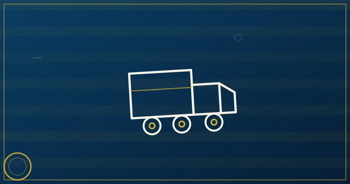 White box truck with liftgate delivering freight at a commercial loading dock