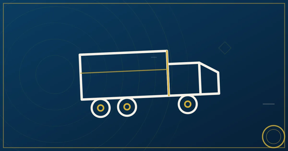 White dry van semi trailer parked at a distribution center illustrating dry van truck insurance coverage needs