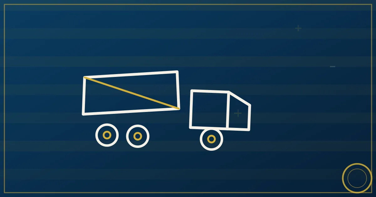 Dump truck unloading gravel at a road construction site with an excavator working nearby