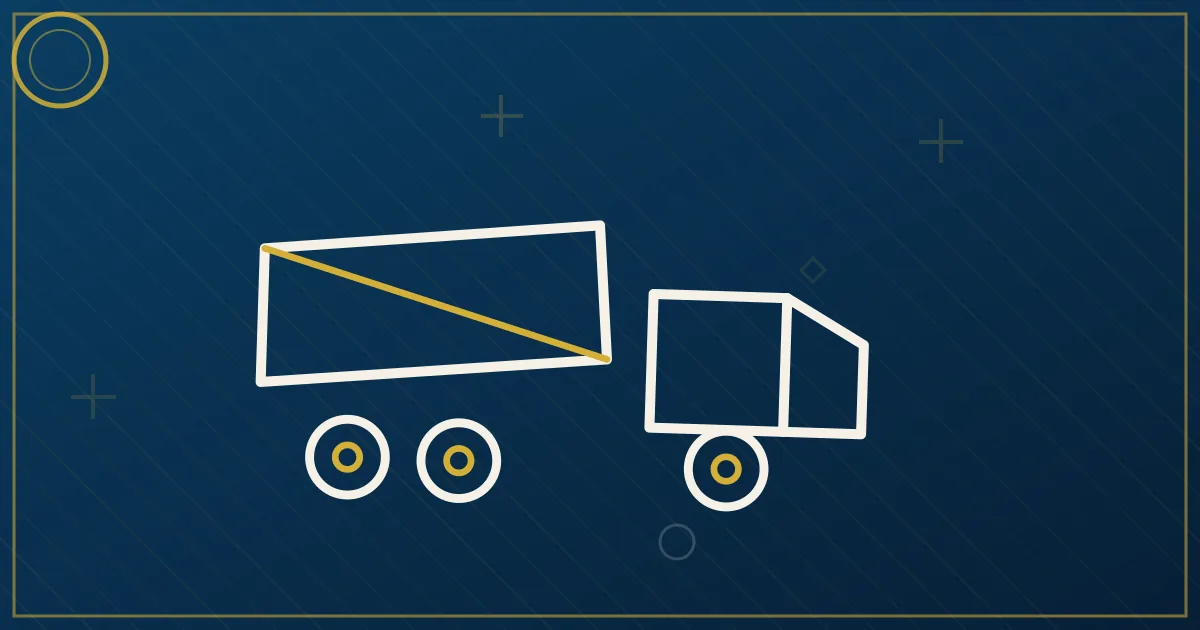 Yellow dump truck with raised bed unloading gravel at a construction jobsite in lapis blue and gold tones