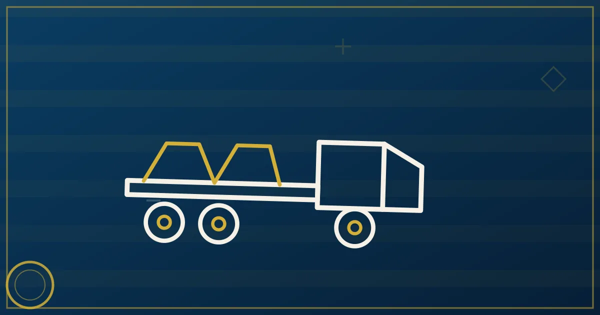 Blue flatbed trailer loaded with steel coils secured with straps on an open highway in lapis blue and gold tones