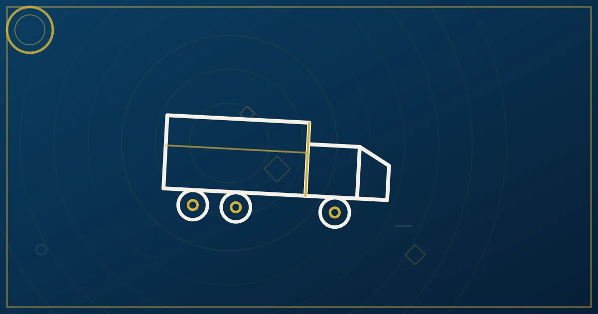 Fleet manager shaking hands with a truck driver beside a semi-truck representing the driver hiring process