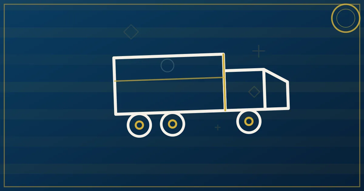 Two semi trucks exchanging trailers at a highway relay point yard during daytime operations