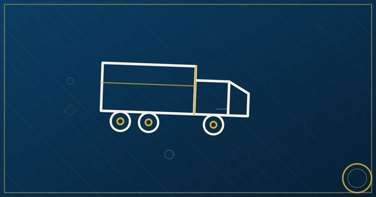 Semi truck fueling at a highway truck stop at dusk, illustrating the major trucking business expense categories