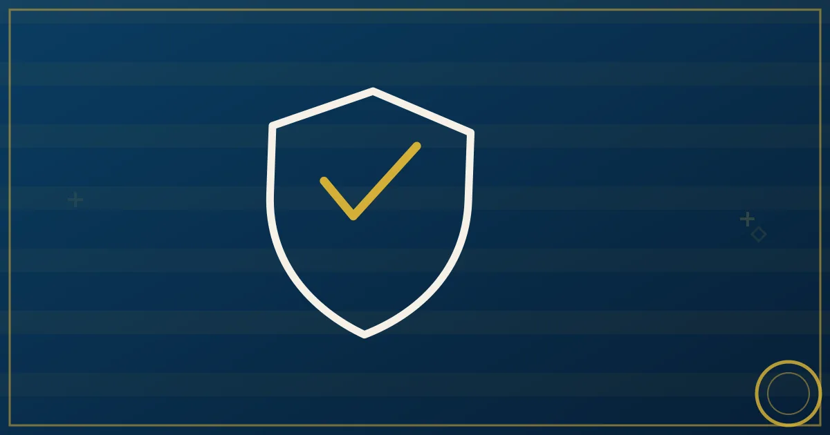Lapis-blue and gold illustration of an insurance broker's desk with policy documents, a shield emblem, and a semi truck